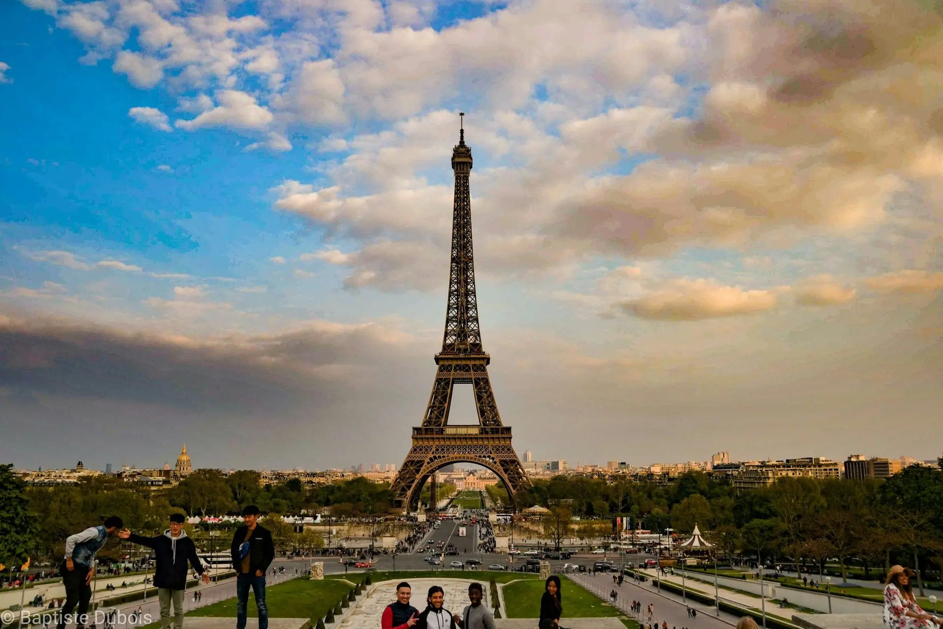 Visitors near the Eiffel Tower entrance during the daytime