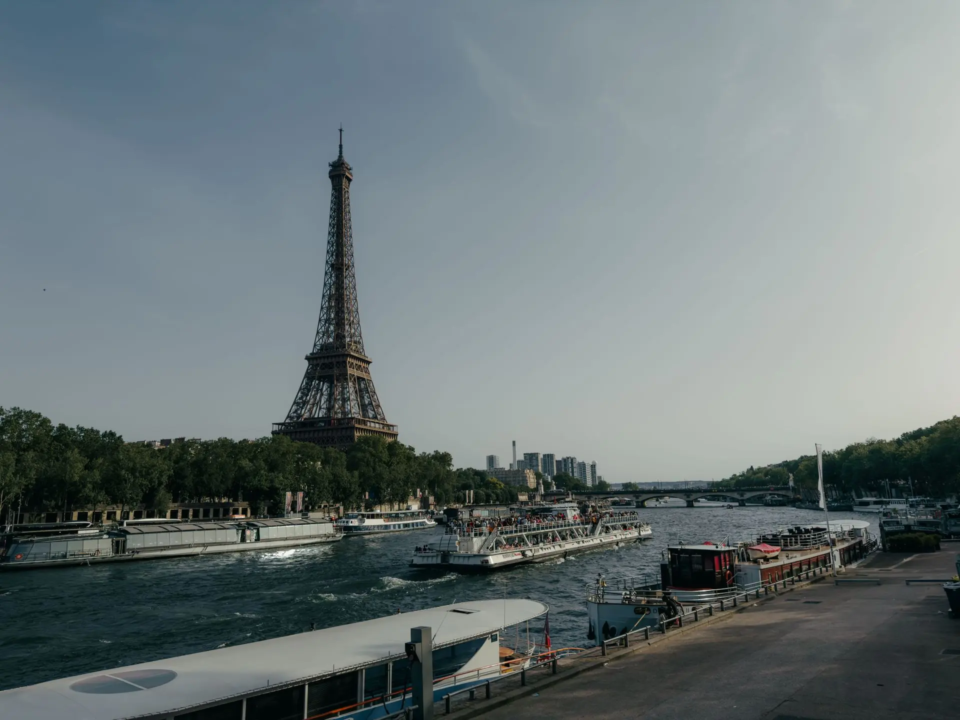A sightseeing boat on the Seine passing the Eiffel Tower A sightseeing boat on the Seine passing the Eiffel Tower